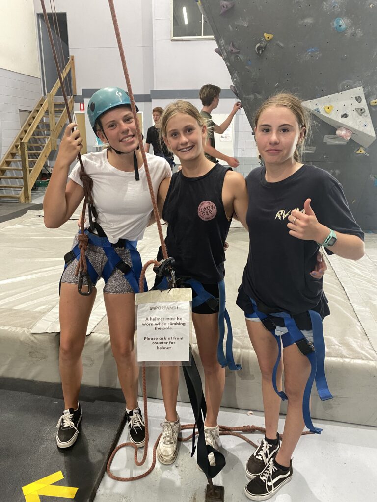 Youth at indoor rock climbing